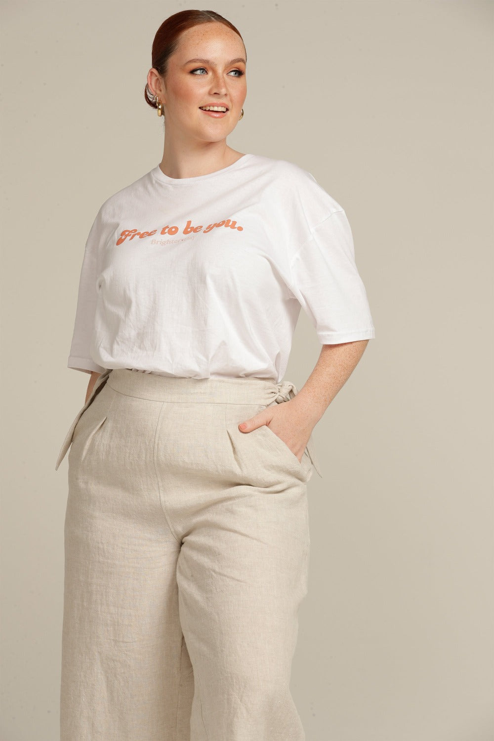 Close up of a Plus sized woman wearing beige linen culottes