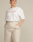 Close up of a Plus sized woman wearing beige linen culottes