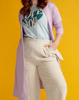 Close up of red haired woman wearing beige linen culottes