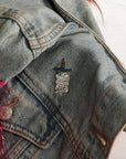 Fighting invisible battles enamel pin on denim jacket