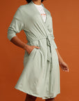 Close up woman in mint cardigan