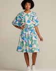 woman wear an adaptive ruffle dress with hidden zips