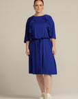 Plus sized woman in royal blue dress with port access