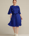 Plus sized woman walking in royal blue dress with port access