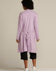 Back view woman in mint cardigan