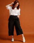 Red-haired woman in black womens culottes