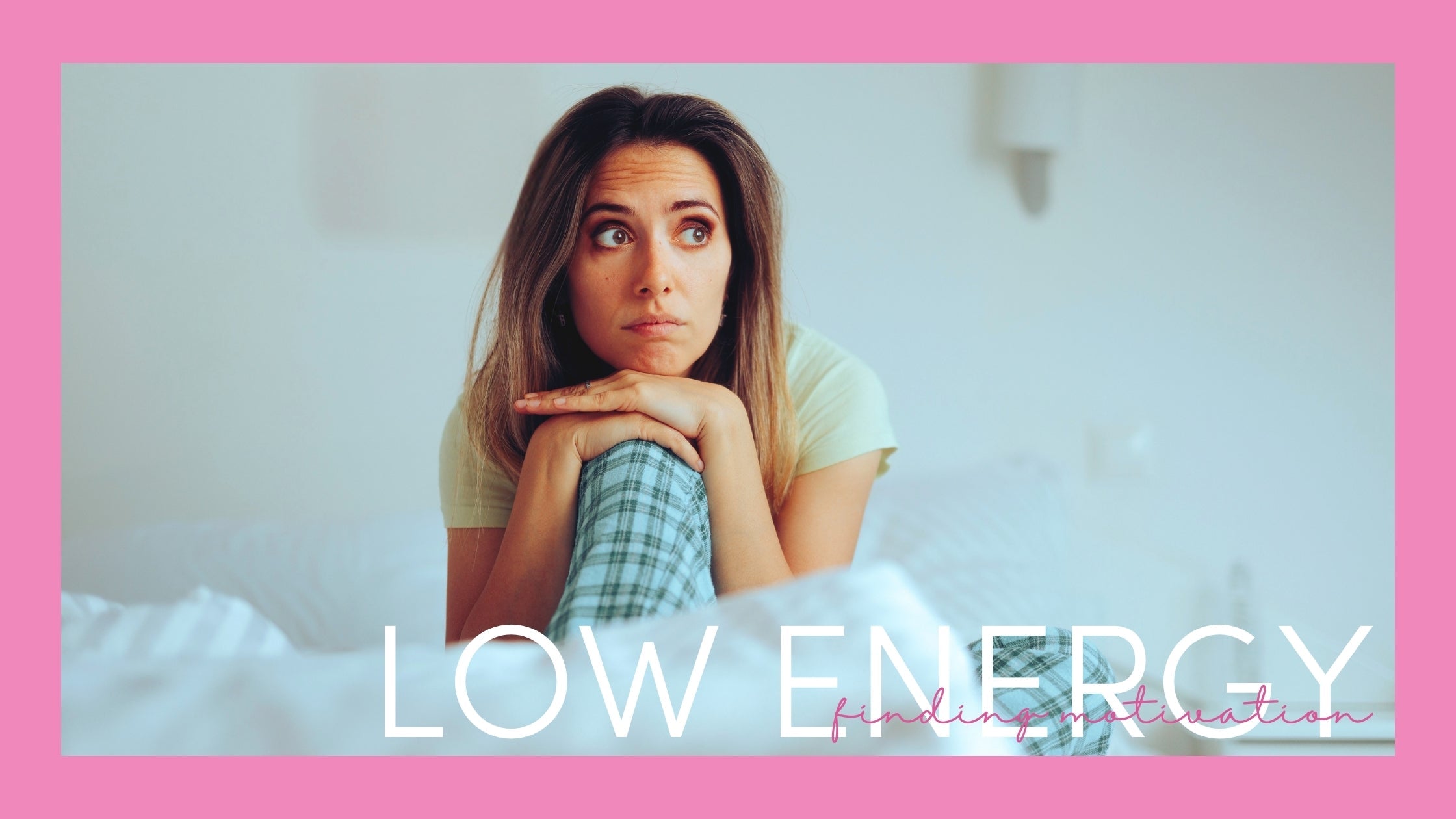 Woman with low energy sitting on bed in pyjamas staring off to the side