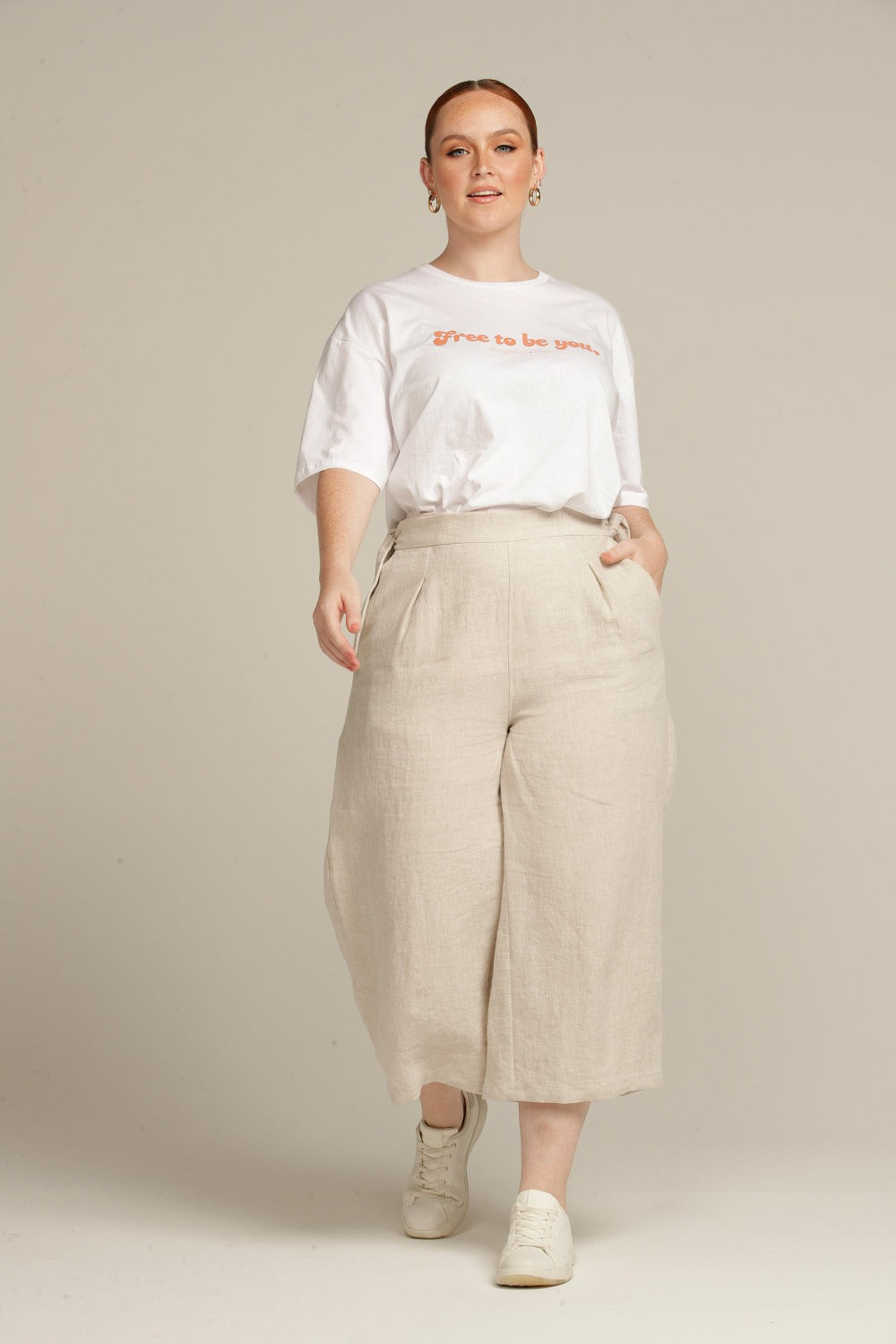 Plus sized woman wears beige linen culottes