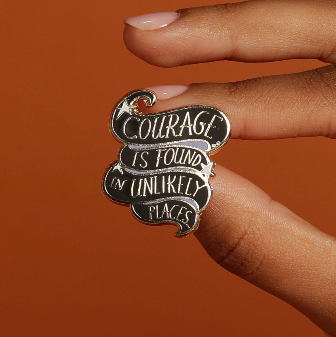 Courage is found in unlikely places enamel pin