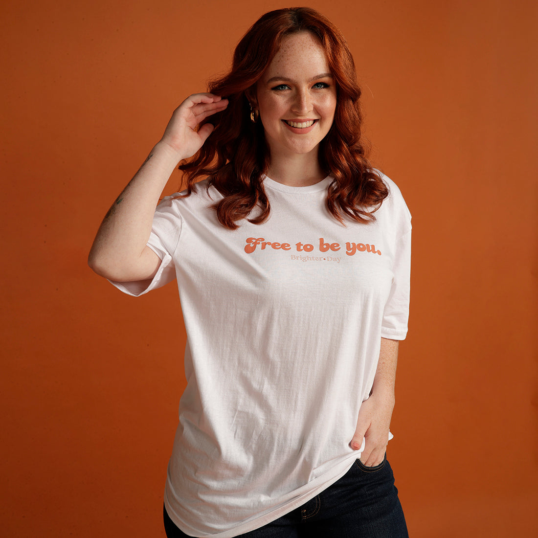 Woman wears Free to be you Brighter day white tee