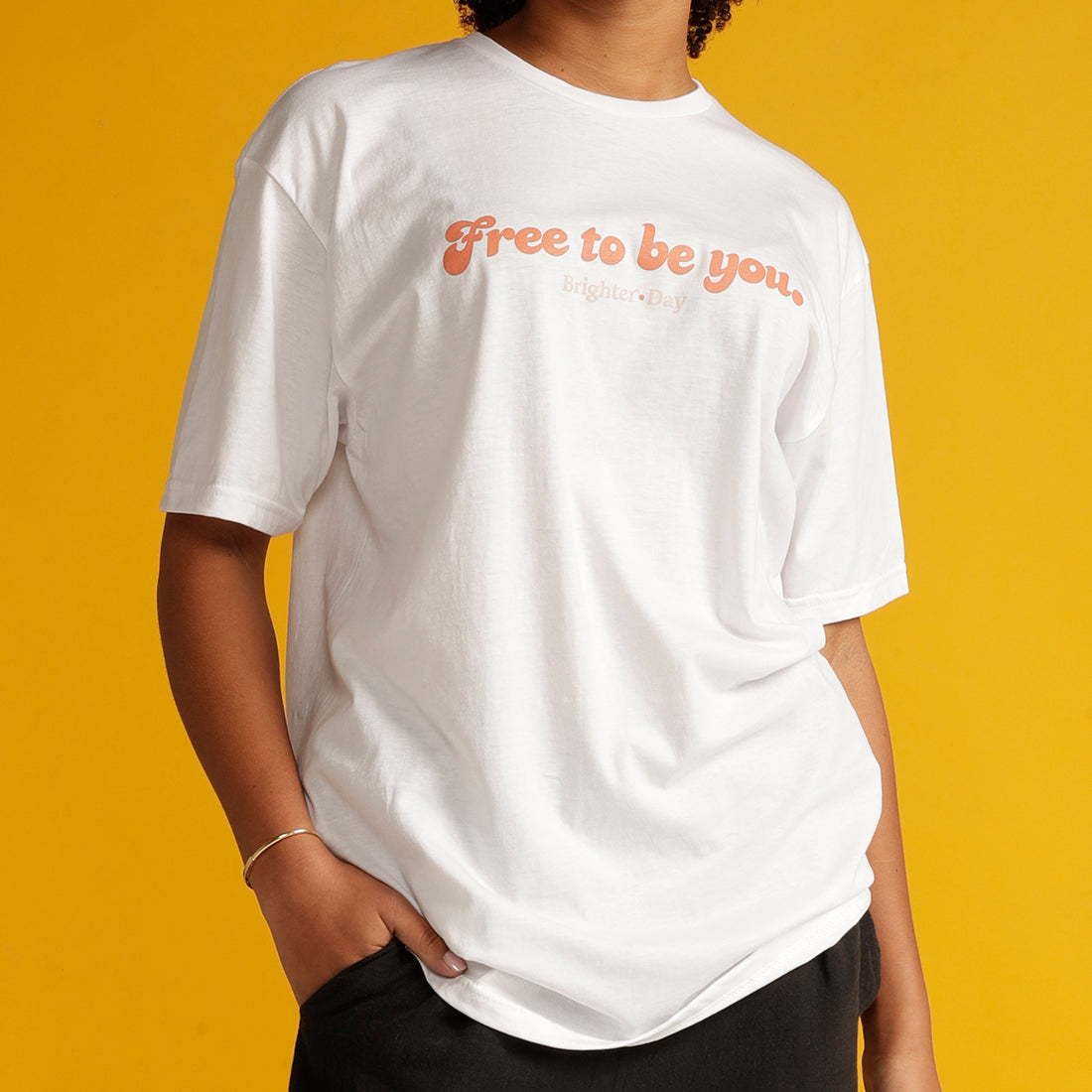 Close up of white Free To Be You tee