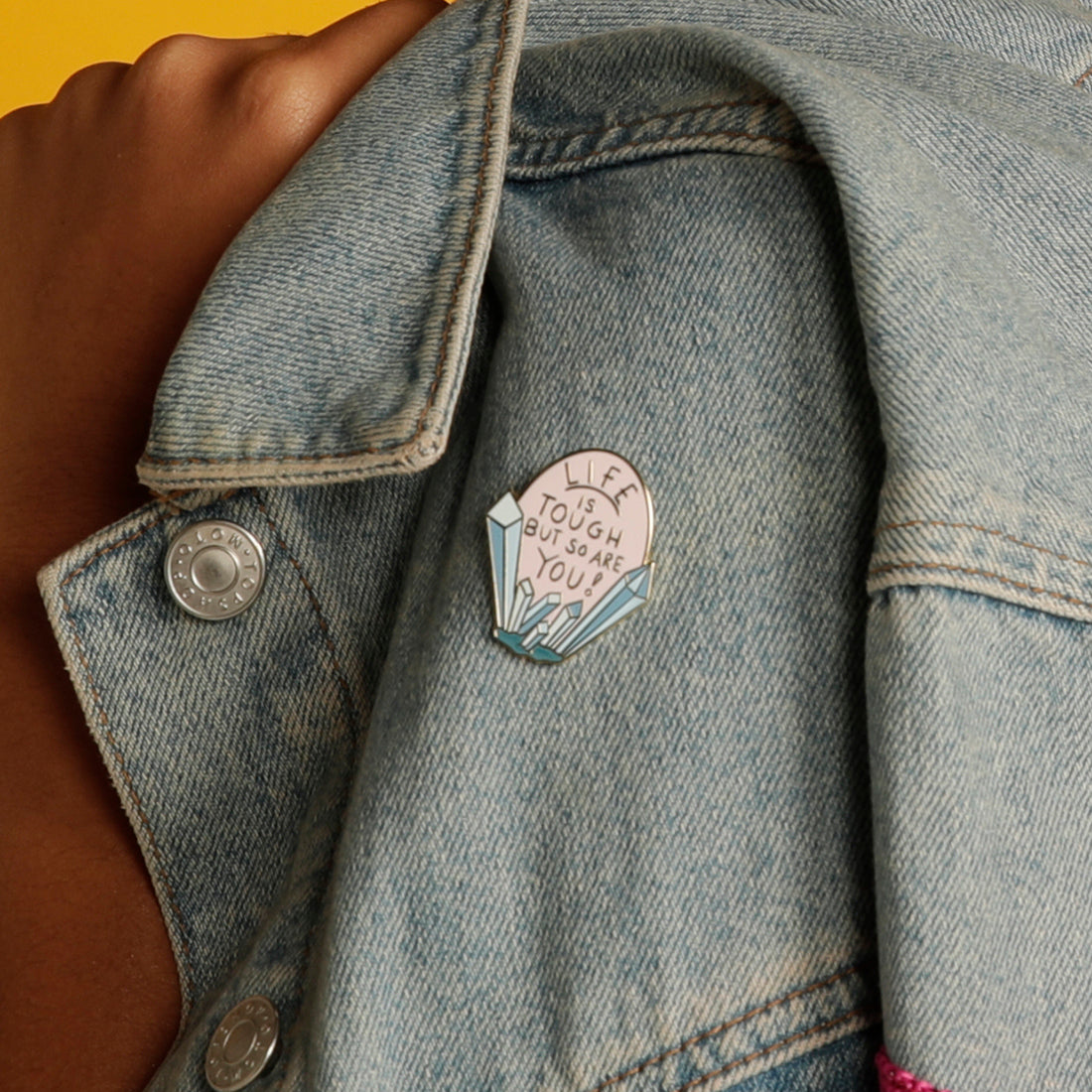 Life is Tough But So Are You enamel pin on denim jacket