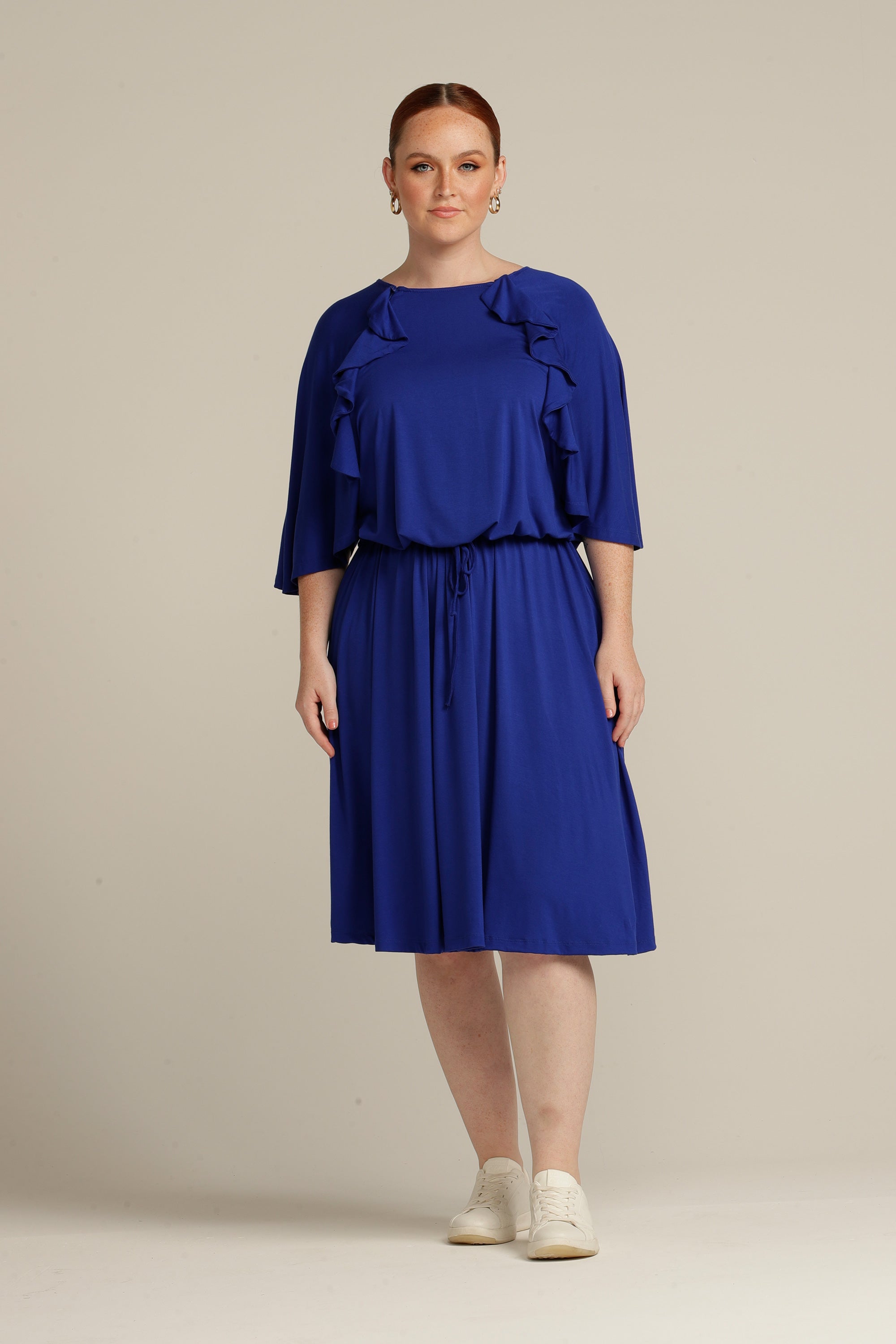 Plus sized woman in royal blue dress with port access