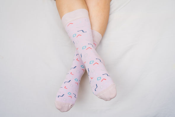 Close up of woman wearing pink socks with confetti pattern